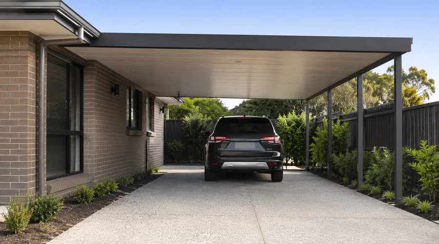 Attached carport connecting to the house — integrated and practical