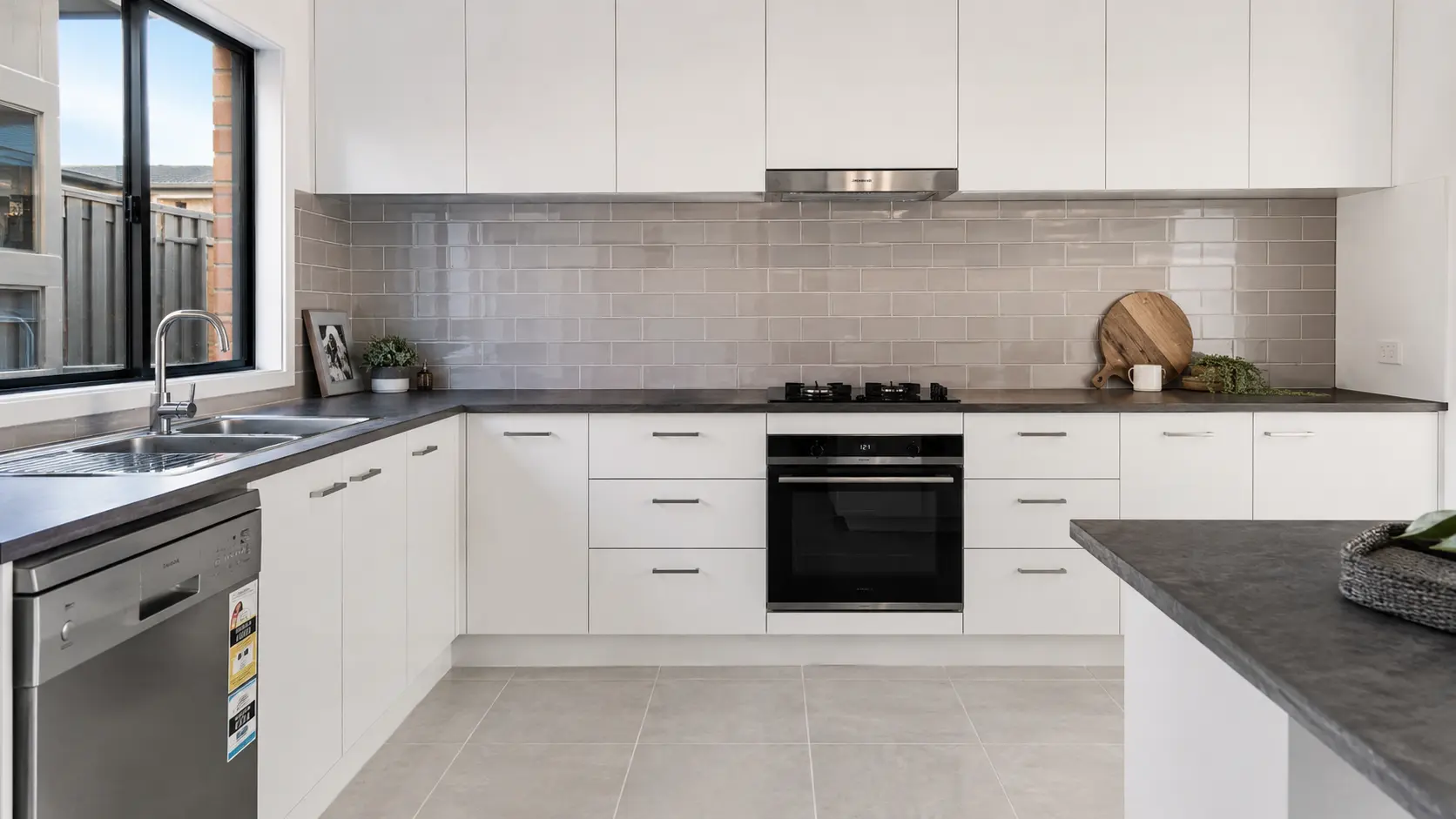 Freshly tiled kitchen floor and splashback in a Melbourne home